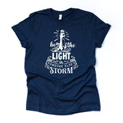 Christian tee, Be The Light in Someone Else's Storm Lighthouse on premium unisex shirt, 2 color choices, 2X, 3X, 4X, plus sizes available